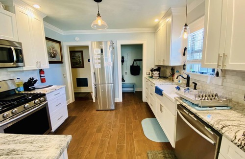 Lawton House | 1 mile to Fort Sill! The CaroleBelle Cottage sleeps 8 with hottub/grills/firepit