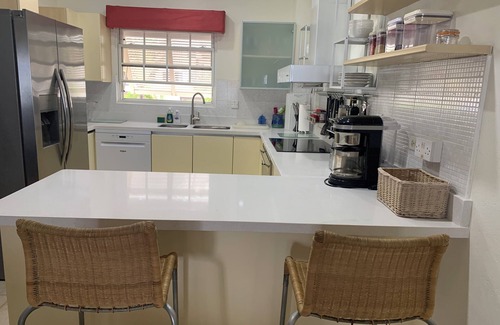 St. Lawrence Gap Apartment | 101 Mistle Cove beach-front luxury, secluded sandy cove, garden and pool.