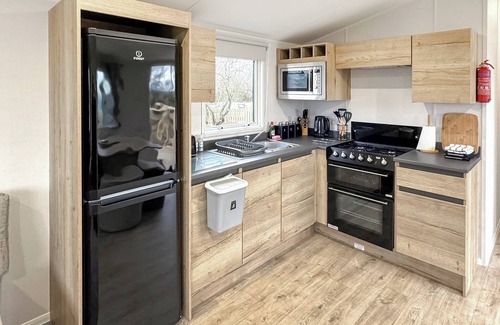 Castle Douglas House | 12ft-wide caravan situated in a coastal position.