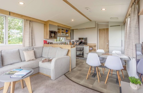 Castle Douglas House | 12ft-wide caravan situated in a coastal position.