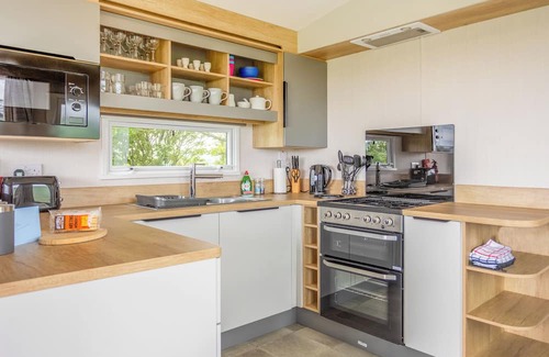 Castle Douglas House | 12ft-wide caravan situated in a coastal position.