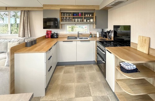 Castle Douglas House | 12ft-wide caravan situated in a coastal position.