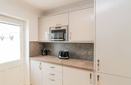 Seaton Cottage | 14 LYME MEWS, pet friendly, with a garden in Seaton, Devon