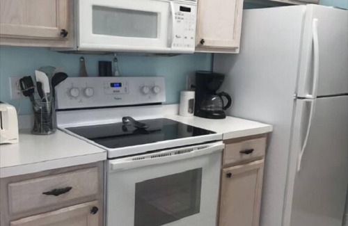 Sunset Beach Condo | 1st floor 2 BR, 2 BA Condo close to Beach & Golf Courses w/Indoor/Outdoor pools