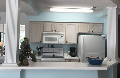 Sunset Beach Condo | 1st floor 2 BR, 2 BA Condo close to Beach & Golf Courses w/Indoor/Outdoor pools