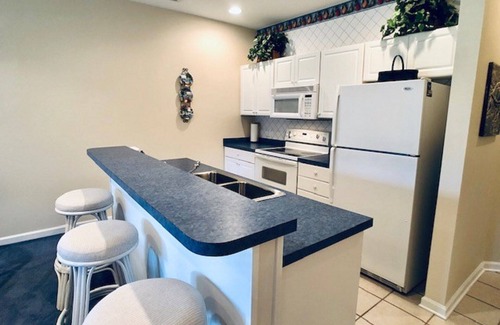 Sea Trail Condo | 2 BDRM Sunset Beach Condo: Screened Patio with view of Jones/Byrd 10th hole.