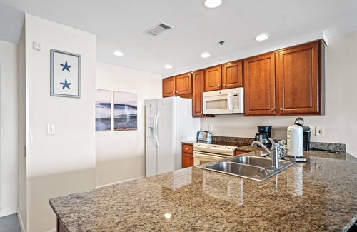 West Panama City Beach Condo | 2BR + 2 Bunk areas, end unit with large balcony, waterpark, beach service