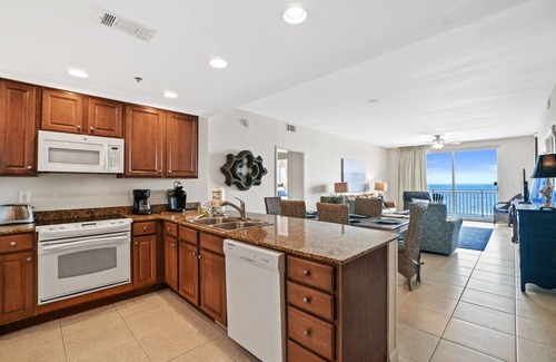 West Panama City Beach Condo | 2BR + 2 Bunk areas, end unit with large balcony, waterpark, beach service