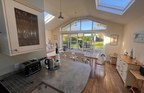 Rhosneigr House | 3 bedroom bungalow - large garden, 2 minutes walk to sandy beaches and village
