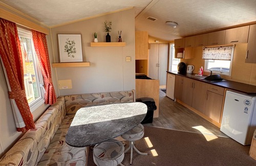Towyn Ski Chalet | 3 bedroom, side gated decking, WiFi, pets welcome