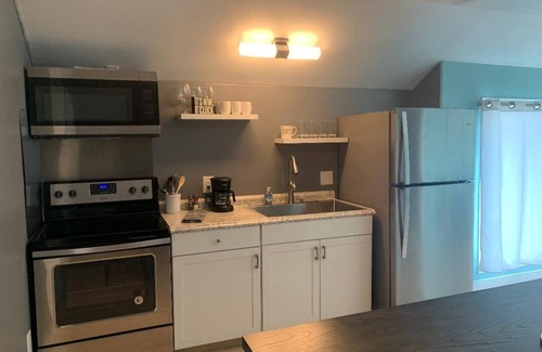 Dennis House | 3 Story Indoor Pool Waterfront Indoor Raquetball Court