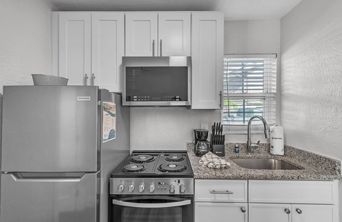 Treasure Island Apartment | 🌞400 ft to the Beach👙Onsite Heated Pool🐬Bungalows #2🌴Grills🐶Dogs Welcome!