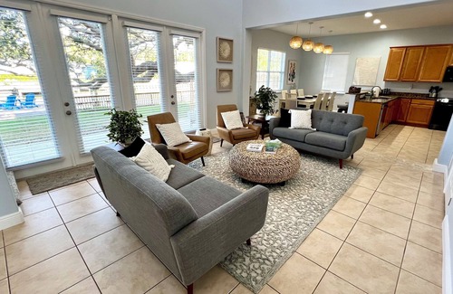 Cocoa Beach House | 4BR Private Canal Home Near Beach: Hot Tub, Tiki Bar, Fire Pit, Dock & Game Room