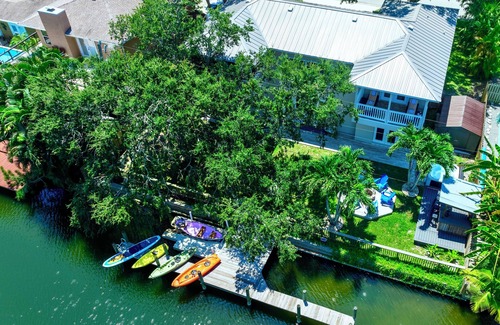 Cocoa Beach House | 4BR Private Canal Home Near Beach: Hot Tub, Tiki Bar, Fire Pit, Dock & Game Room