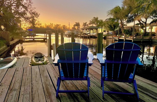 Cocoa Beach House | 4BR Private Canal Home Near Beach: Hot Tub, Tiki Bar, Fire Pit, Dock & Game Room