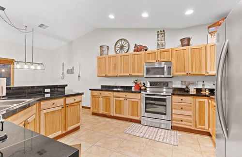 Ronald House | 5-star family home with game room, private hot tub, summer pool, near the lake!