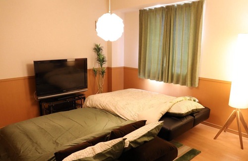 Naka Ward Apartment | 901 A room with a modern taste of healing superv / Nagoya Aichi