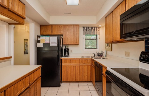 Caswell Beach House | 9th Tee: Patio Home Overlooking the 9th Tee with Screened Porch Close to Beach