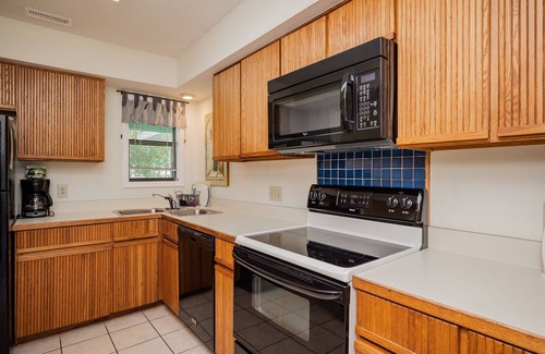 Caswell Beach House | 9th Tee: Patio Home Overlooking the 9th Tee with Screened Porch Close to Beach