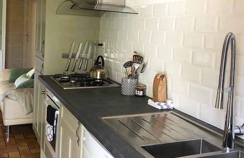 Henansal Cottage | A 2 bedroom gite sleeping 4 plus a cot with access to a heated covered pool.