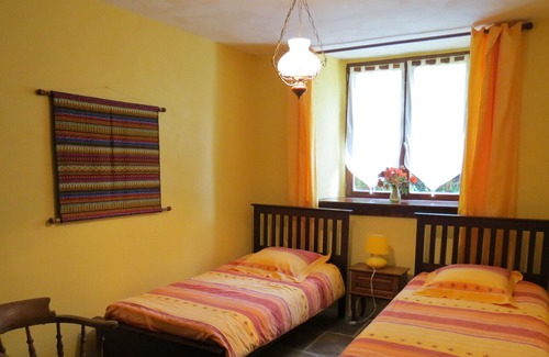 Plumeliau House | A Beautifully Restored Coach House With Heated Pool in large garden