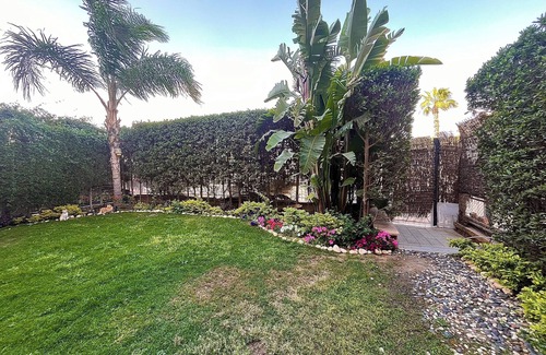 Sheikh Zayed City Apartment | A boho ground-floor apartment with garden view in a quiet area neighborhood