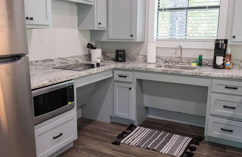 Livingston Cabin | A Cozy ADA Accessible Getaway Right on the Water, Two Creeks Crossing Resort