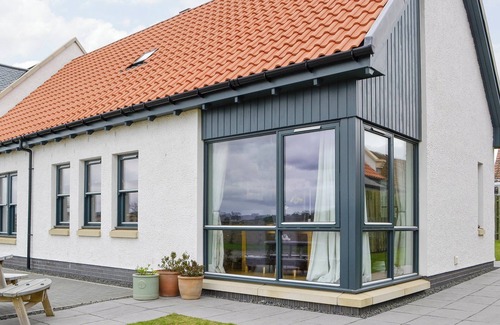 Linlithgow Cottage | A rural property based on a working farm with wood burner.