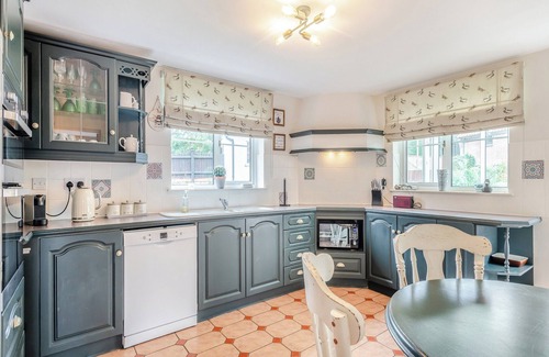 Saxthorpe Cottage | A spacious, bright property with a large inglenook fireplace and lovely furnishings.