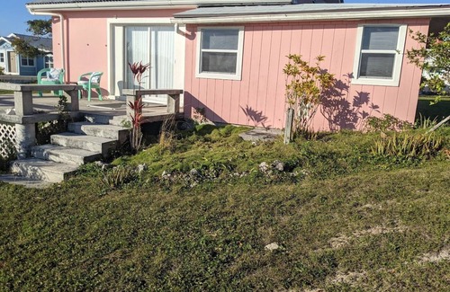 Green Turtle Cay Cottage | Adorable Pink cottage-OCEAN FRONT on Coco Bay with a dock. 25% fall discount!