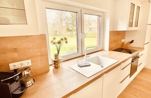 Tating Apartment | "Alle zusammen" - Modern and bright vacation apartment with large garden
