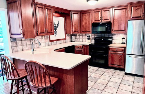Phoenixville House | Amazing Home Near Town with Game Room, King Beds, Great Views, and a Gym.