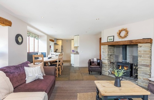 Fence Cottage | An 1800’s barn conversion with beams, exposed stonework and flagged floors.