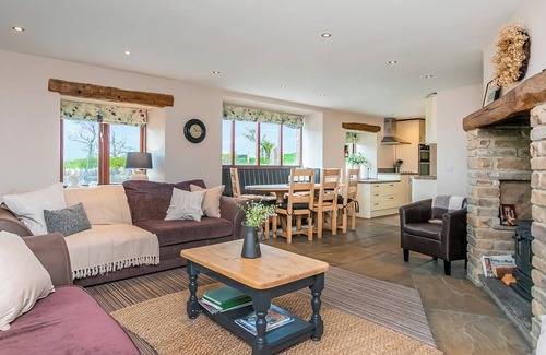 Fence Cottage | An 1800’s barn conversion with beams, exposed stonework and flagged floors.
