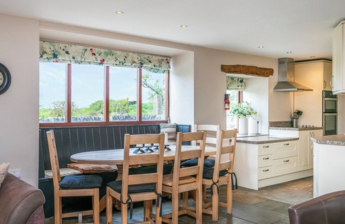 Fence Cottage | An 1800’s barn conversion with beams, exposed stonework and flagged floors.