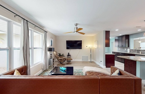 Palm City House | Angler's oasis with dock, boat lift, river views, hot tub, & furnished patio