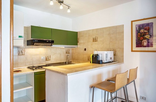 Calceranica al Lago Apartment | Apartment 'Garden Alle Barche - Marina 7' with Lake View, Shared Garden and Wi-Fi