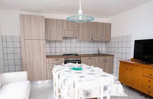 Budoni Apartment | Apartment 'Malamuri 5 Sun Vacanze' with Sea View, Shared Pool and Shared Garden