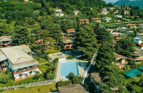 Villaggio Sanghen House | Apartment on Lake Garda with pebble beach pier for boat three swimming pools