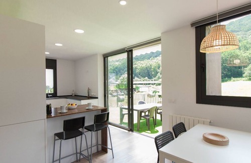 La Vall de Bianya Apartment | Apartment with large terrace and mountain views