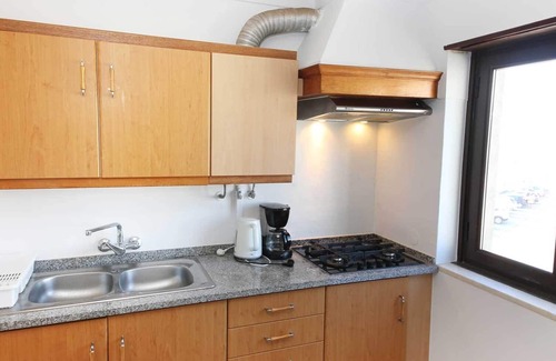 Ericeira Apartment | Apartment with roof terrace and barbecue in the center of Ericeira and directly on the sea