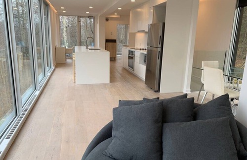 Lac Superieur Village Ski Chalet | Architectural home with panoramic mountain views.