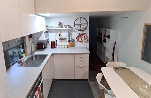 Pukehangi House | Arias Farmlet Tiny Home - quiet bungalow with breakfast, spa, animals to feed