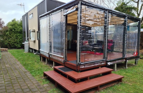 Pukehangi House | Arias Farmlet Tiny Home - quiet bungalow with breakfast, spa, animals to feed