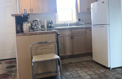 Rose Park House | Art Moderne Bungalow -Private Home with Fenced Yard close to Downtown & U of M.