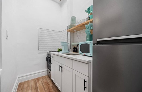 Upper Manhattan Condo | Artful 3BDR: Near Subway, Stadium + Private Patio