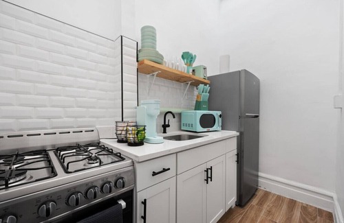 Upper Manhattan Condo | Artful 3BDR: Near Subway, Stadium + Private Patio