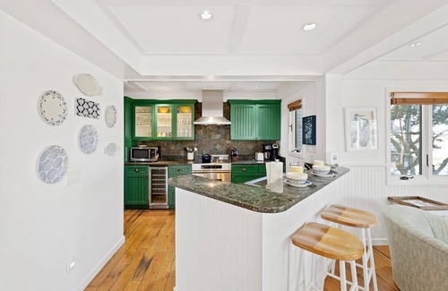 Bald Head Island Condo | As you enter, the Bald Head Creek and marsh vistas-through the walls of windows-catch your eye.