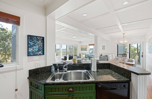 Bald Head Island Condo | As you enter, the Bald Head Creek and marsh vistas-through the walls of windows-catch your eye.