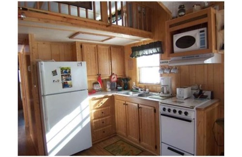 Naples Cabin | Assoc beach, Lakes, Naples Causeway, restaurants, shops, boat- jet ski rentals.